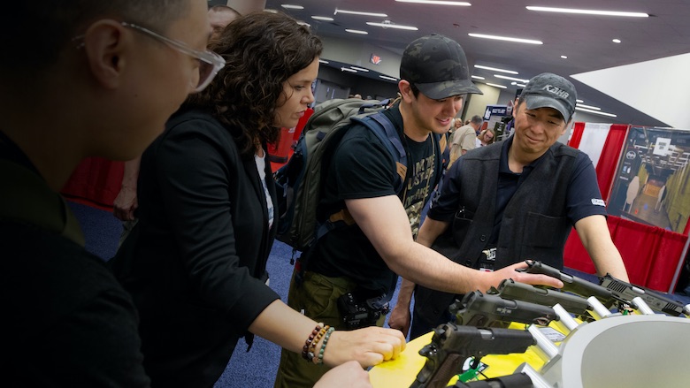Inspecting handguns at the NRA Annual Meetings